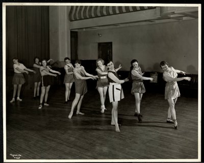 Mrs. Dean and eight dancing girls in the gymnasium of the New York Association for the Blind, 111 East 59th Street, New York, 1935 by Byron Company